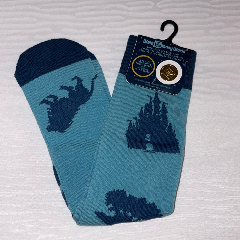 Walt Disney World blue icon socks with removable pin. New